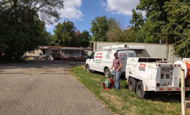 jack frost van parked doing drain service Battle Creek MI