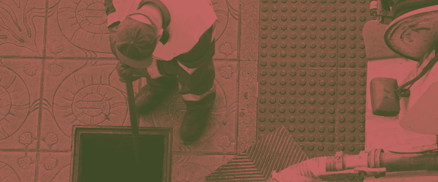 worker doing commercial drain service Battle Creek MI